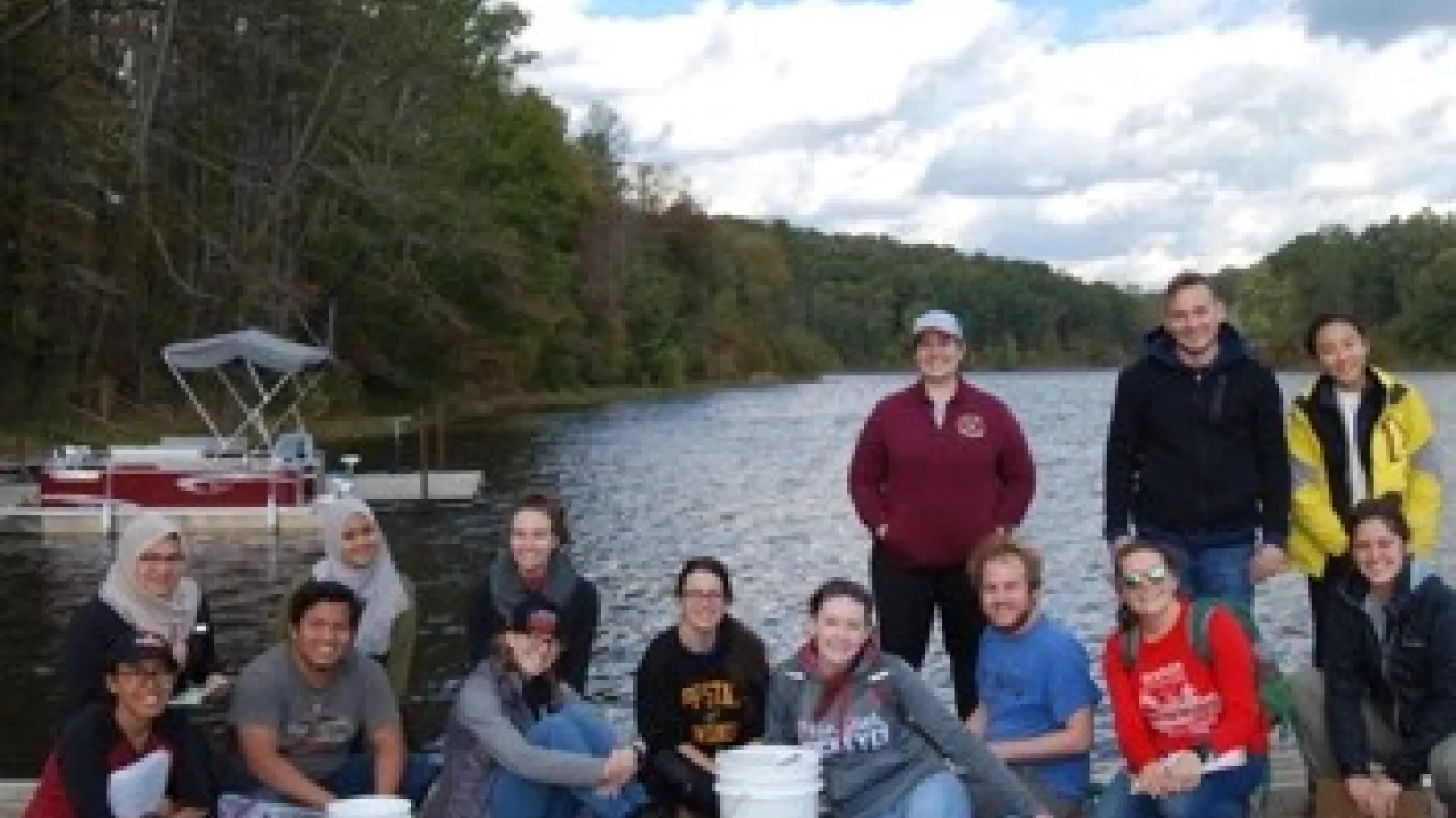 Geochemistry class poses at Lake Hope boat dock