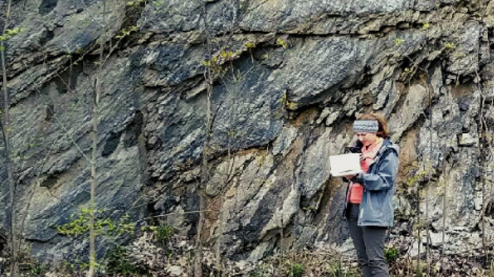 Ally Brady making notes in the field
