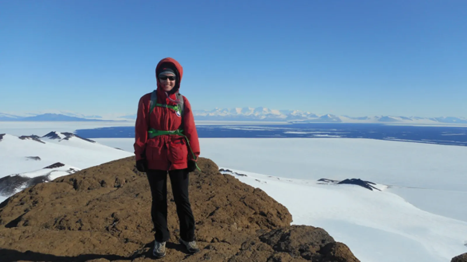 Earth Science student Elsa Saelens poses for a picture in frigid Antarctica