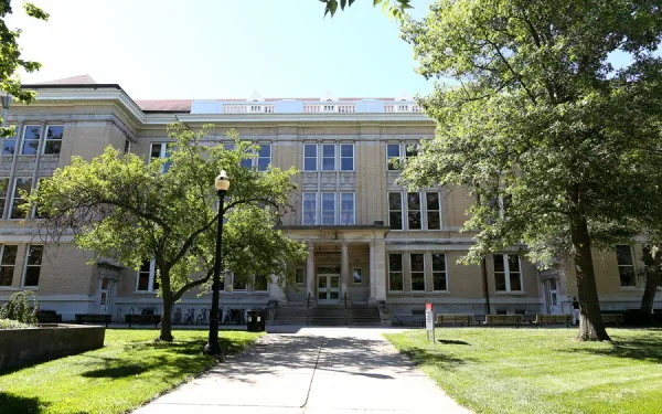 modern photo of the front of Mendenhall Laboratory in the summer