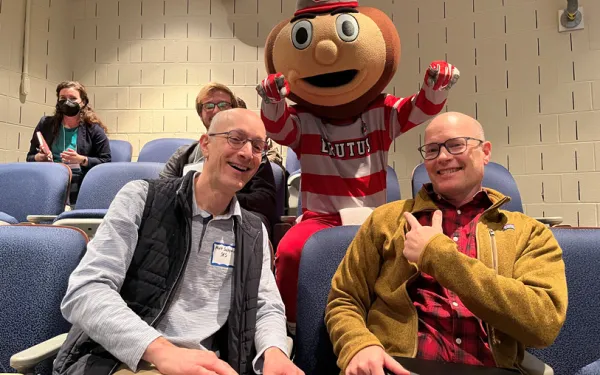 Professors Saltzman and Mark posing with Brutus