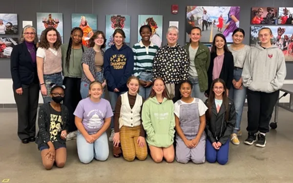 students from Columbus School for Girls sit and stand with Dr. Lindy Elkins-Tanton 