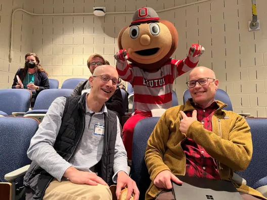 Professors Saltzman and Mark posing with Brutus