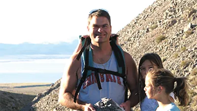 Denis Balcer '90 outside rock hunting