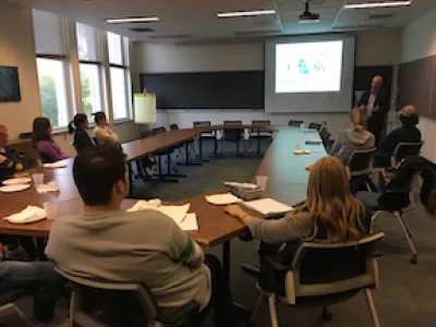 An earth science speaker leads a discussion